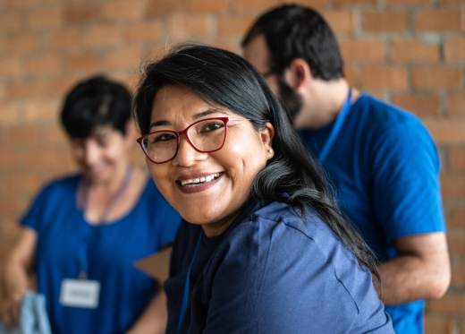 Woman smiles as she works with a group for a HammondCare Foundation fundraiser