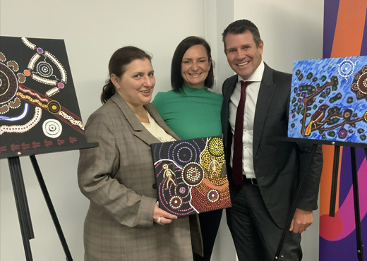 Ngarrindjeri woman Tanya Conlan holding her artwork developed for the HammondCare Reconciliation Action Plan