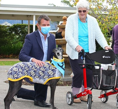 HammondCare CEO Mike Baird and HammondCare Horsley resident Thelma Connaughton with greyhound LB