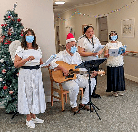 Carol singing for residents living with dementia. From left, Carol Blandchard, Jonathon Paulo, Moanna Muller and Kim Nguyen