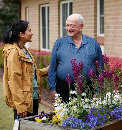 Careworker Roshni talks with Hammondville resident Ted in the garden