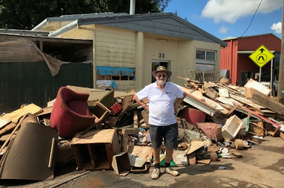 man-stands-in-front-of-flood-damaged-home-hammondcare