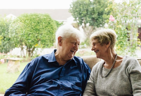 An older man and his carer enjoy respite care at Candlebark Cottage in Goulburn.