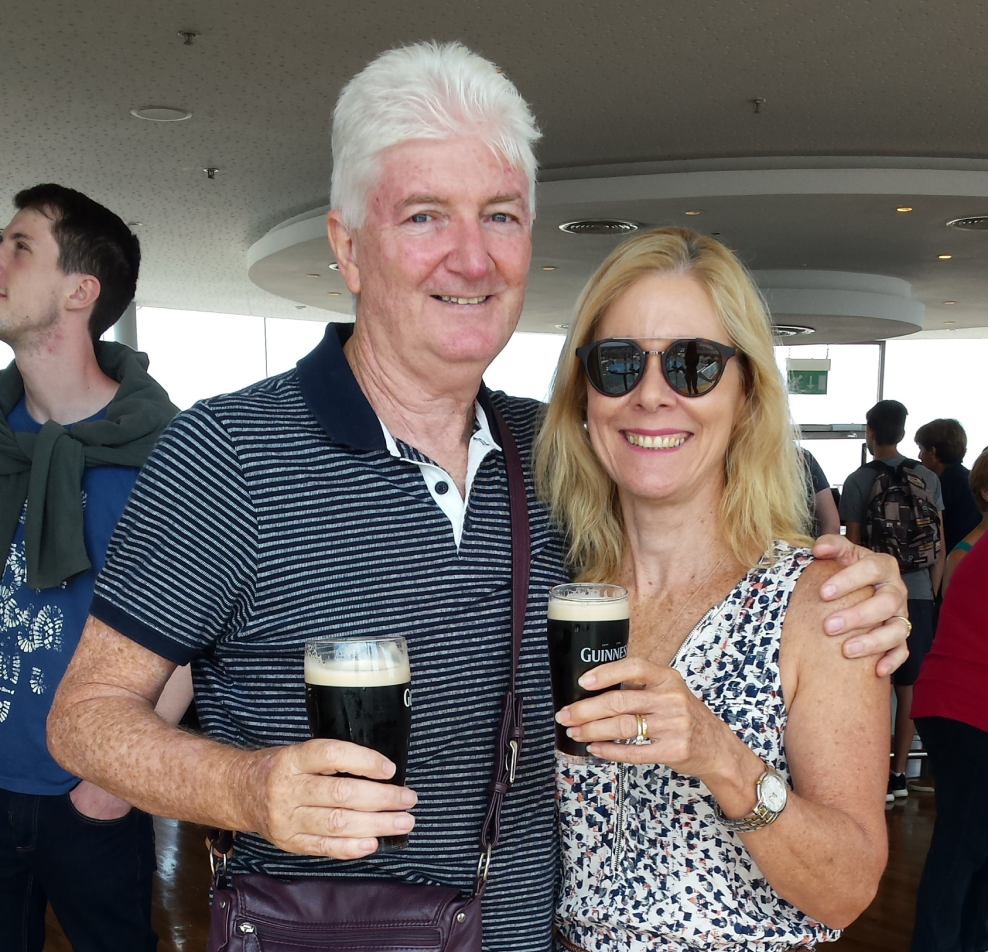 Sean and Jo Byrne smiling and holding a drink