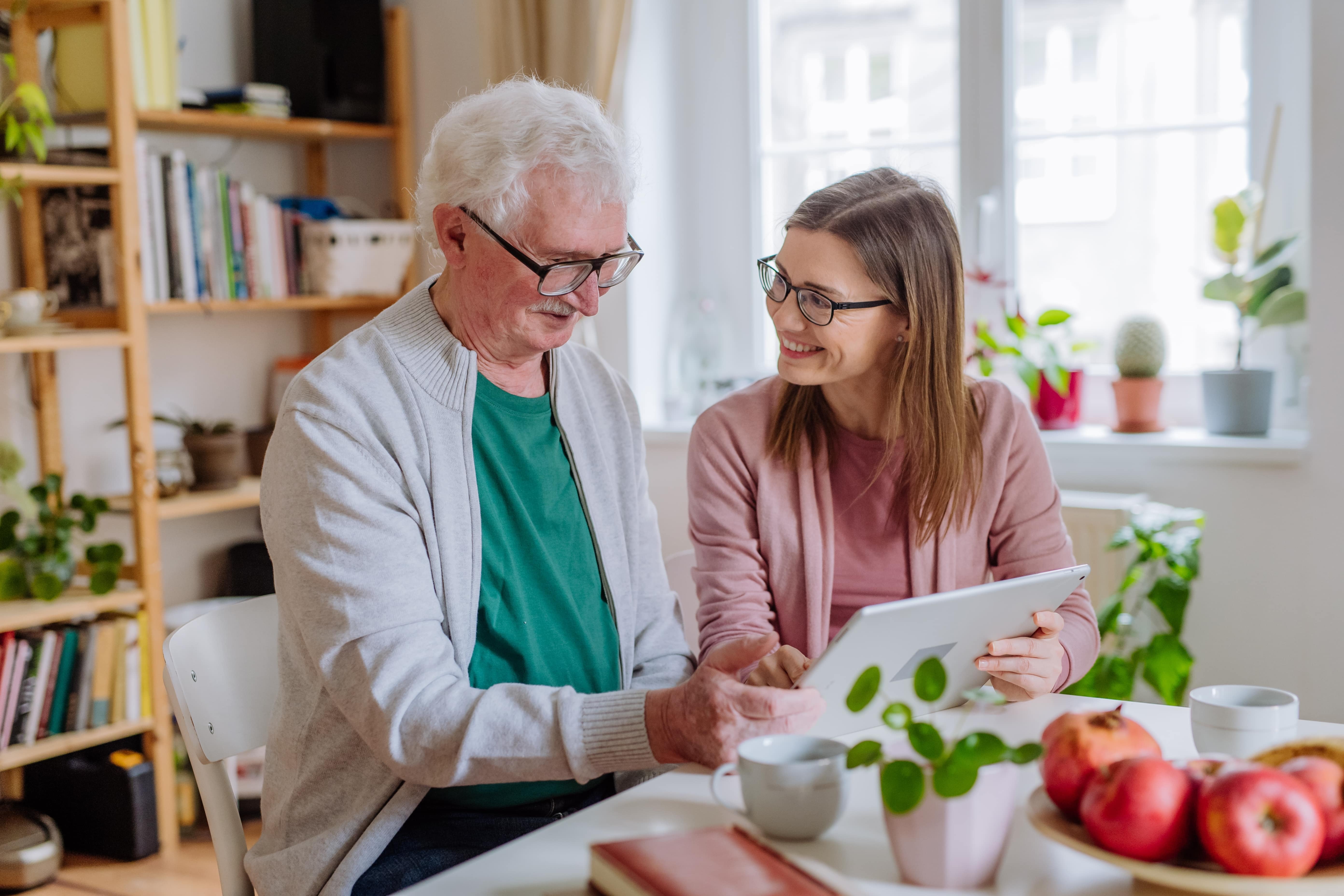 DSA patient and carer using a laptop to explore online resources