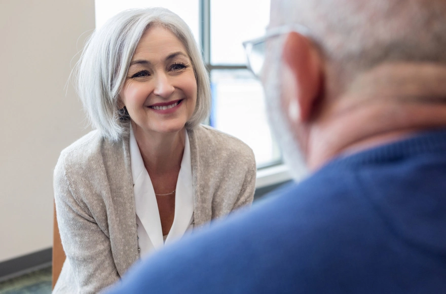 A man consults with a healthcare professional at HammondCare Braeside Hospital.